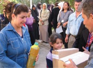 2003 | Syria - IOCC volunteers distributing hygiene and school kits to children