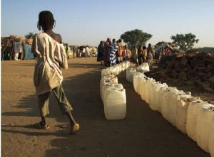 2014 | Jordan, Ethiopia - People with cans of water