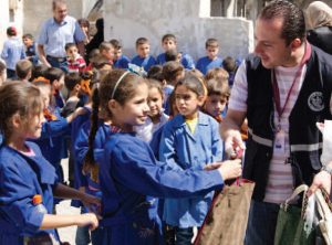 2018 | Syria - IOCC volunteers distributing hygiene and school kits to children